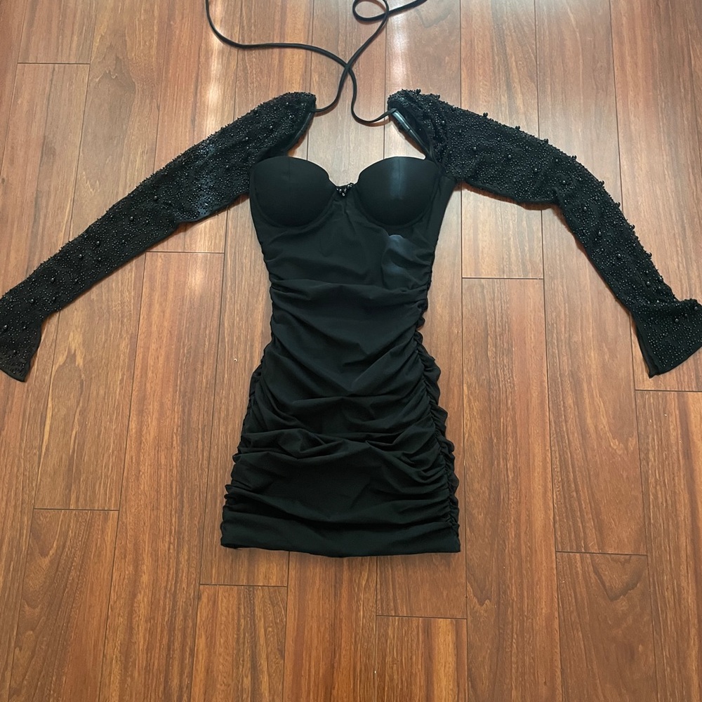 Cute black embellished long sleeve mini dress size 2. Daughter worn only 1 time.